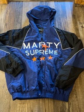 Supreme Blue and Black Hooded Windbreaker with Orange Star Accents